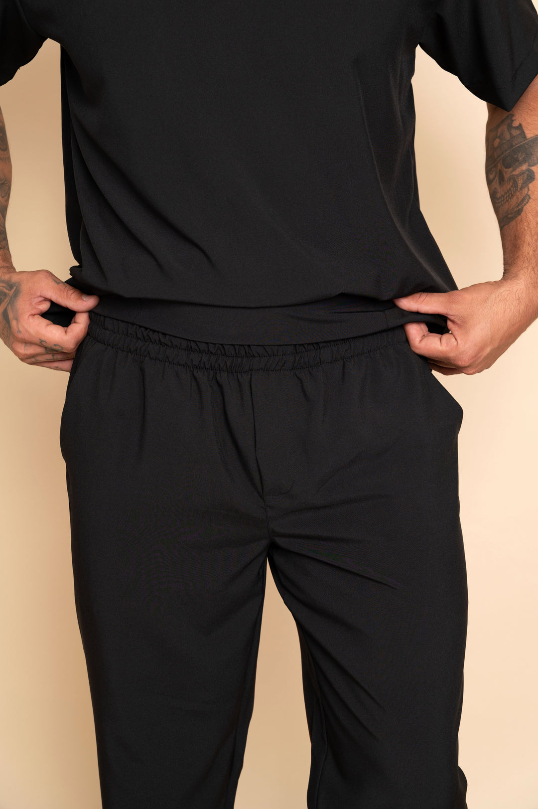 Men's black scrub set with functional pockets