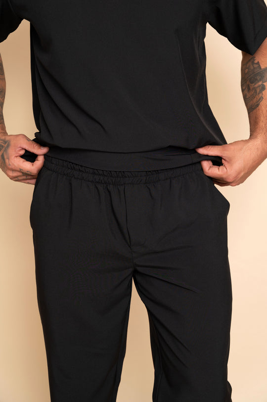 Men's black scrub set with functional pockets