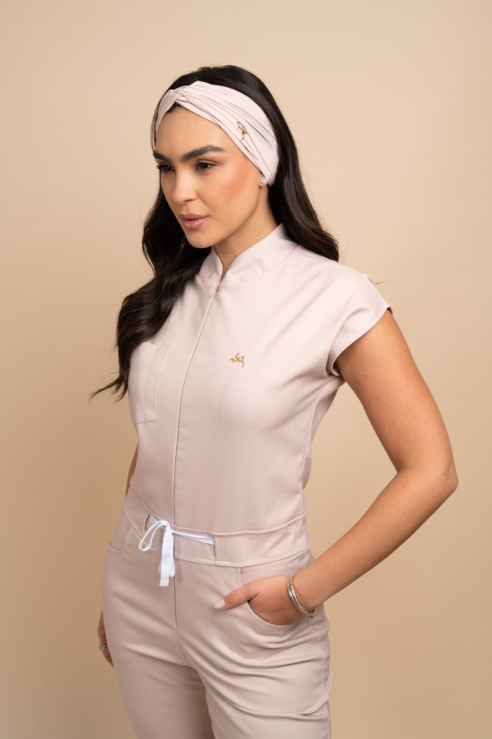 Nude scrub jumpsuit with mandarin collar and hidden zipper